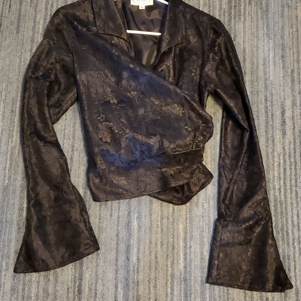 Beautiful lace wrap blouse with black lining